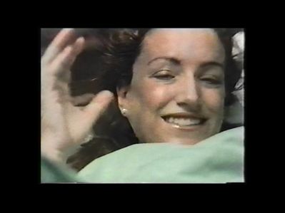Parto Natural con Noesiterapia mujer sonriendo después del parto